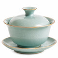 Bol à thé en porcelaine avec couvercle et motifs floraux blancs